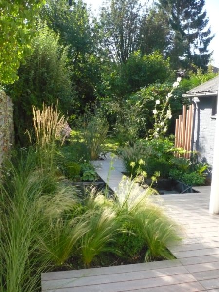 Massifdegraminéesetterrasseenboisexotiquejpg Massifdegraminéesetterrasseenboisexotiquejpg